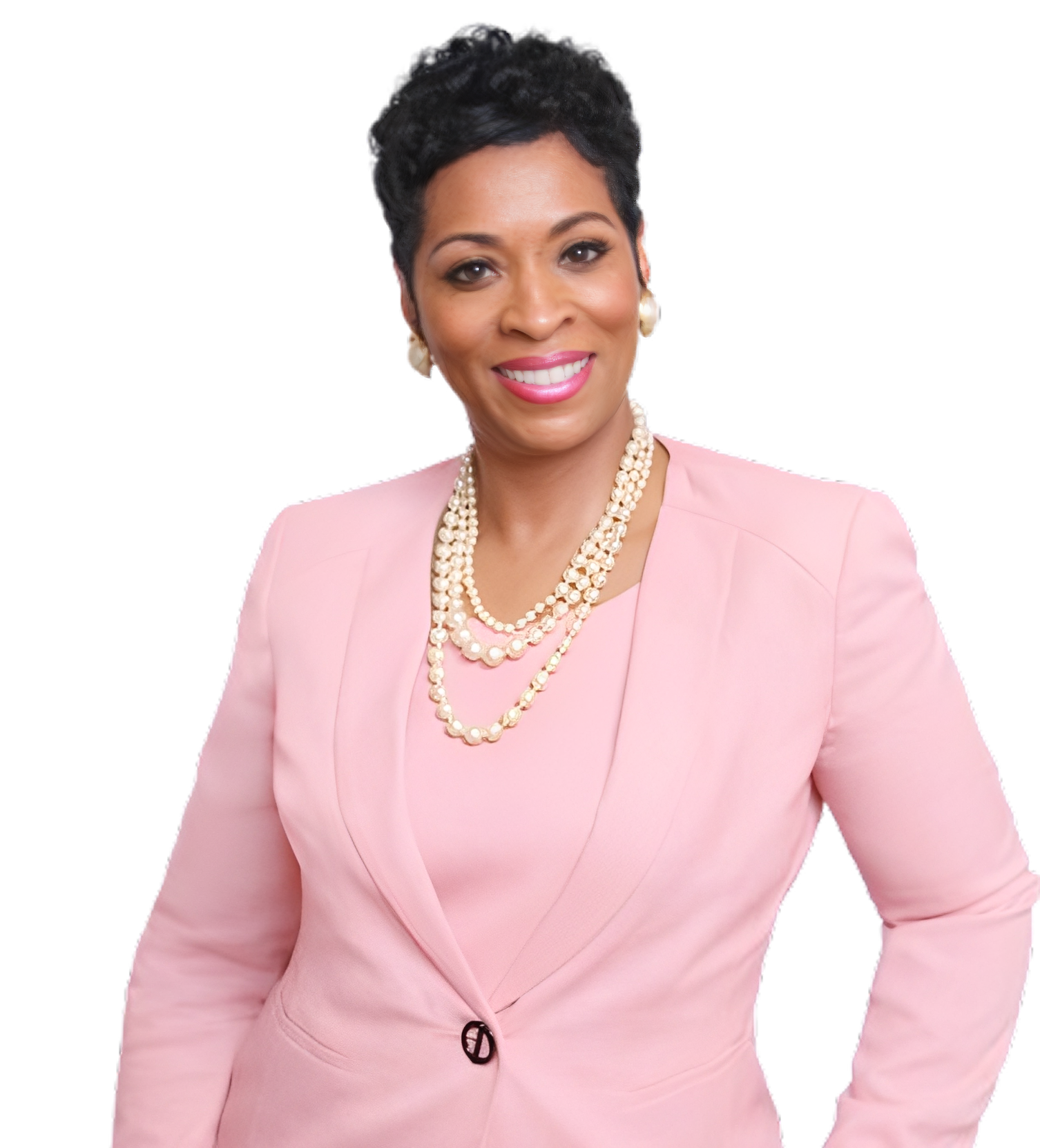 Woman in pink suit with pearl necklace.