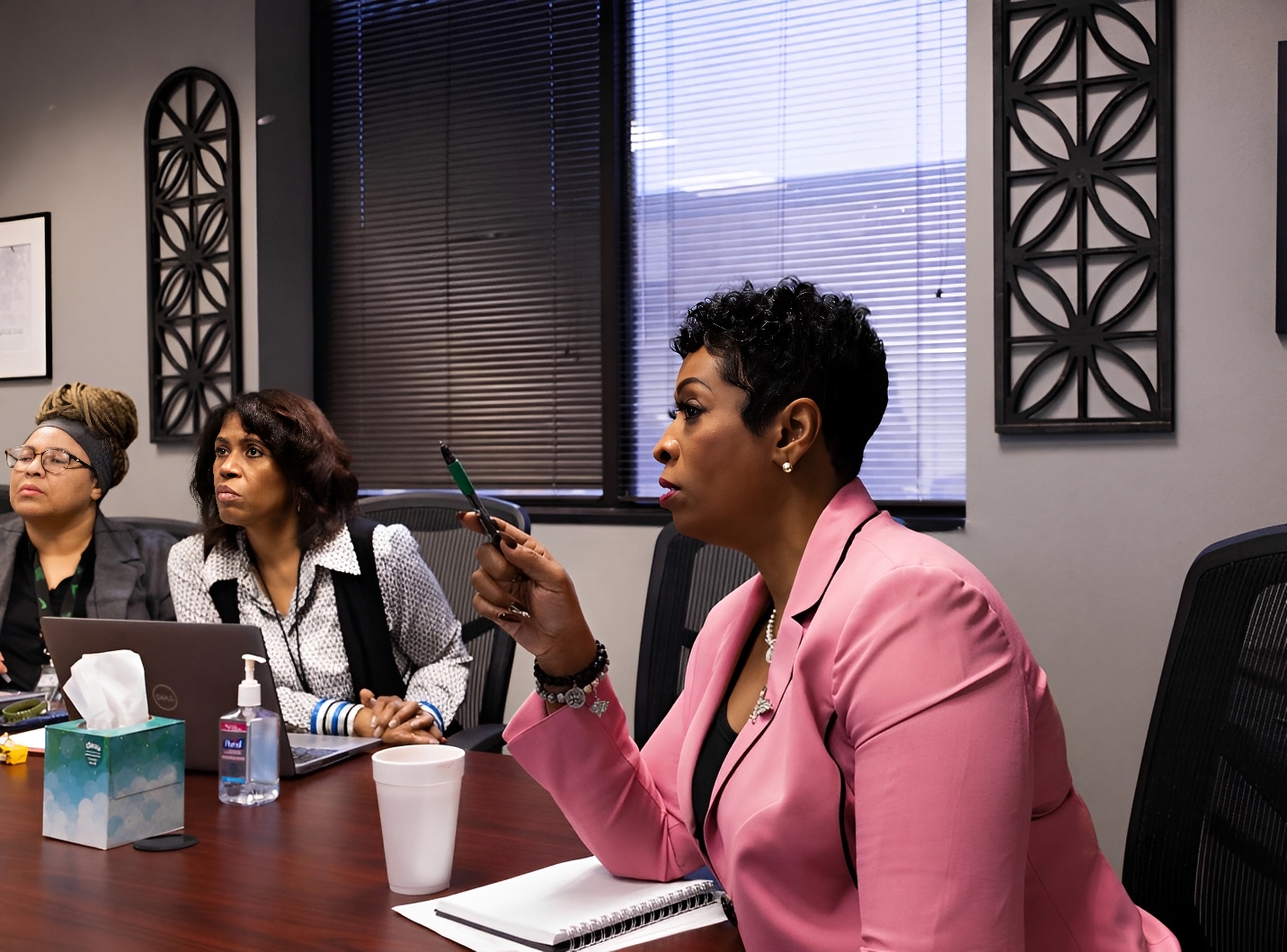 Women attentively listening in a business meeting.